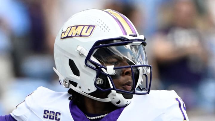 Sep 21, 2024; Chapel Hill, North Carolina, USA; James Madison Dukes quarterback Alonza Barnett III (14) looks to pass in the first quarter at Kenan Memorial Stadium. Mandatory Credit: Bob Donnan-Imagn Images