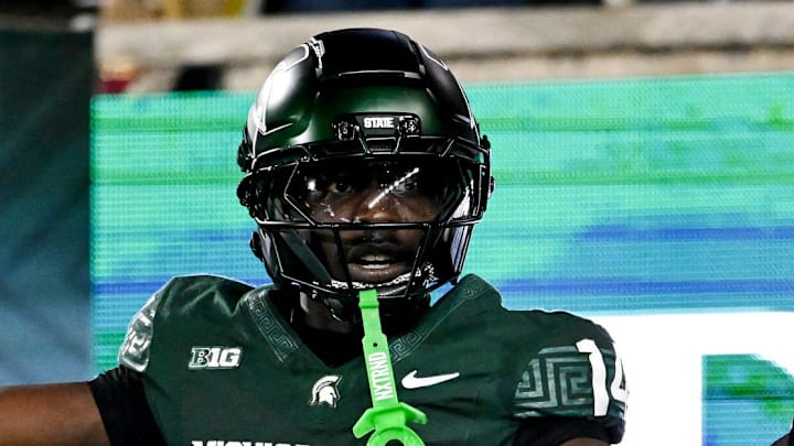 Michigan State's Malcolm Bell, right, reacts after getting called for pass interference against Michigan's Andrew Marsh during the first quarter on Saturday, Oct. 25, 2025, at Spartan Stadium in East Lansing.