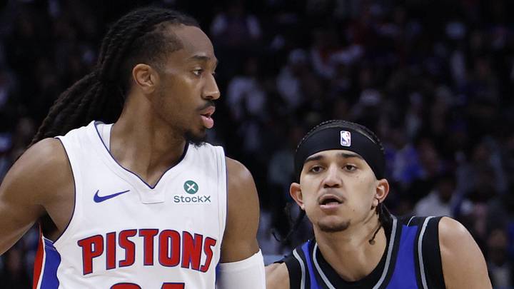 Detroit Pistons guard Daniss Jenkins dribbles defended by Orlando Magic guard Anthony Black. Detroit Pistons guard Daniss Jenkins dribbles defended by Orlando Magic guard Anthony Black.