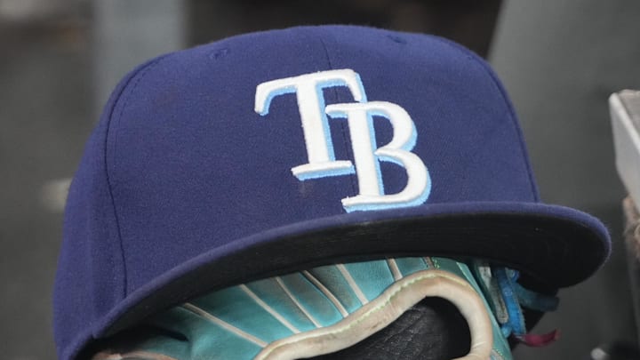 Sep 26, 2025; Toronto, Ontario, CAN; The hat and glove of Tampa Bay Rays third baseman Junior Caminero (13) in the dugout during the game against the Toronto Blue Jays at Rogers Centre. 