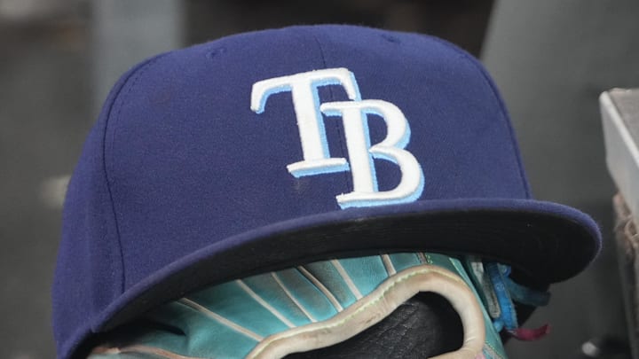 Sep 26, 2025; Toronto, Ontario, CAN; The hat and glove of Tampa Bay Rays third baseman Junior Caminero (13) in the dugout during the game against the Toronto Blue Jays at Rogers Centre. 