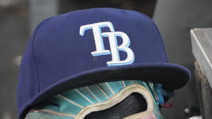 Sep 26, 2025; Toronto, Ontario, CAN; The hat and glove of Tampa Bay Rays third baseman Junior Caminero (13) in the dugout during the game against the Toronto Blue Jays at Rogers Centre. 