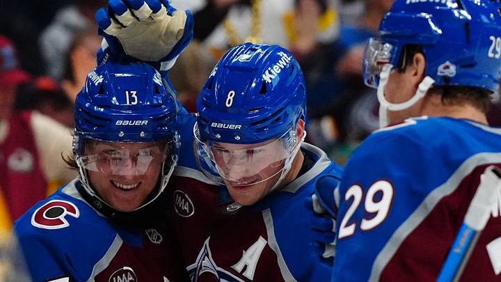 Oct 16, 2026; Denver, Colorado, USA;  Colorado Avalanche right wing T.J. Hughes (13) celebrates his first NHL goal with defenseman Cale Makar (8) against the Pittsburgh Penguins in the second period at Ball Arena.  Mandatory Credit: Ron Chenoy-Imagn Images