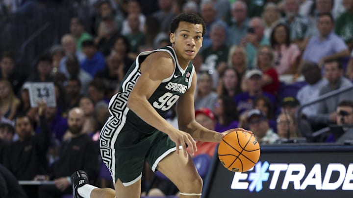 Nov 25, 2025; Fort Myers, Florida, USA; Michigan State Spartans guard Divine Ugochukwu (99) controls the ball against the East Carolina Pirates in the second half at Suncoast Credit Union Arena. Nov 25, 2025; Fort Myers, Florida, USA; Michigan State Spartans guard Divine Ugochukwu (99) controls the ball against the East Carolina Pirates in the second half at Suncoast Credit Union Arena.