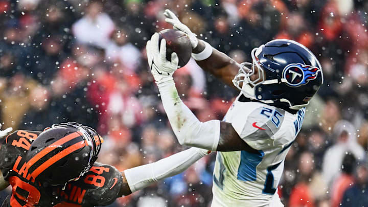 Tennessee Titans safety Xavier Woods (25) intercepts a pass