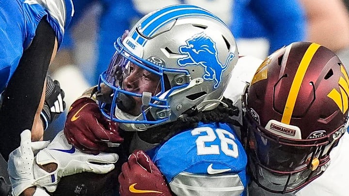 Detroit Lions running back Jahmyr Gibbs (26) is tackled by Washington Commanders safety Jeremy Chinn (11) Detroit Lions running back Jahmyr Gibbs (26) is tackled by Washington Commanders safety Jeremy Chinn (11)