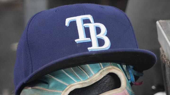 Sep 26, 2025; Toronto, Ontario, CAN; The hat and glove of Tampa Bay Rays third baseman Junior Caminero (13) in the dugout during the game against the Toronto Blue Jays at Rogers Centre. 