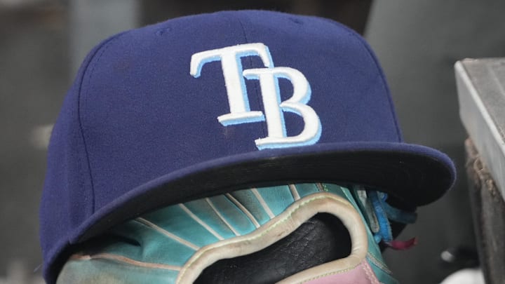 Sep 26, 2025; Toronto, Ontario, CAN; The hat and glove of Tampa Bay Rays third baseman Junior Caminero (13) in the dugout during the game against the Toronto Blue Jays at Rogers Centre. 