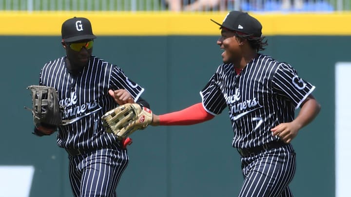 Greenville Drive outfielder Nelly Taylor (1) celebrates with Greenville Drive outfielder Yophery Rodriguez (7) Sunday, Aug. 24, 2025 during the MiLB baseball game against the Hub City Spartanburgers at Fifth Third Park in Spartanburg, South Carolina.
