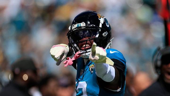 Jacksonville Jaguars wide receiver Travis Hunter (12) reacts to his carry during the first quarter of an NFL football matchup, Sunday, Oct. 12, 2025, at EverBank Stadium in Jacksonville, Fla.