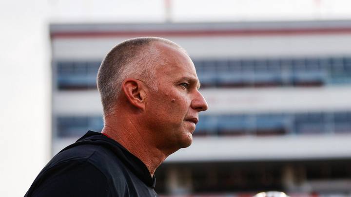 Aug 28, 2025; Raleigh, North Carolina, USA; North Carolina State Wolfpack head coach Dave Doeren looks on during the warmups prior to the game against East Carolina Pirates at Carter-Finley Stadium. Mandatory Credit: Jaylynn Nash-Imagn Images