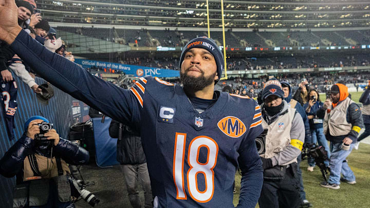 Chicago Bears quarterback Caleb Williams (18) high fives fans after their game Saturday, December 20, 2025 at Soldier Field in Chicago, Illinois. The Chicago Bears beat the Green Bay Packers 22-16 in overtime.