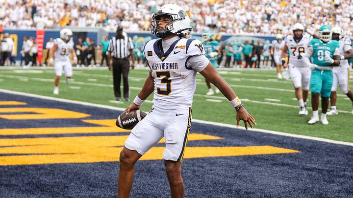 Sep 5, 2026; Morgantown, West Virginia, USA;  West Virginia Mountaineers quarterback Michael Hawkins Jr. (3) runs the ball in for a touchdown during the fourth quarter against the Coastal Carolina Chanticleers at Milan Puskar Stadium.  Mandatory Credit: Ben Queen-Imagn Images