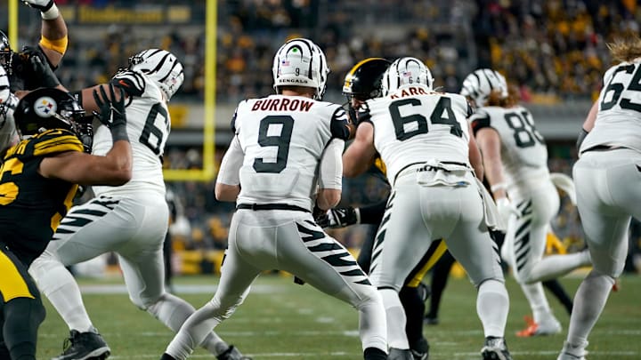 Nov 20, 2022, Pittsburgh, Pennsylvania, USA; Cincinnati Bengals quarterback Joe Burrow (9) moves in the pocket as the offensive line blocks in the second quarter against the Pittsburgh Steelers at Acrisure Stadium. Mandatory Credit: Kareem Elgazzar/The Enquirer-Imagn Images
