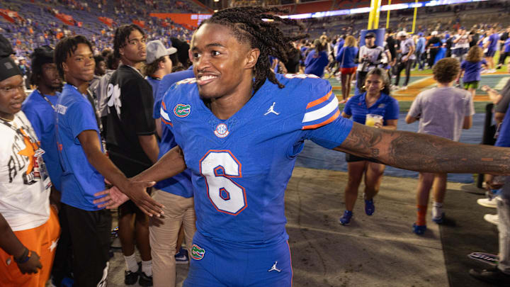 Florida Gators wide receiver Elijhah Badger (6) gives high-fives to fans after the Gators defeated the LSU Tiger 27-26 at Ben Hill Griffin Stadium in Gainesville, FL on Saturday, November 16, 2024. [Doug Engle/Gainesville Sun]