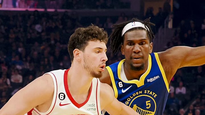 Feb 24, 2023; San Francisco, California, USA; Houston Rockets Alperen Sengun (28) drives in against Golden State Warriors Kevon Looney (5) during the first quarter at Chase Center. Mandatory Credit: Kelley L Cox-Imagn Images