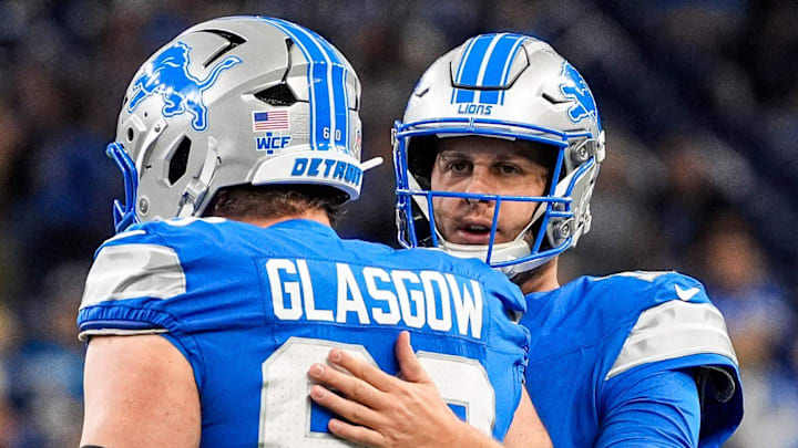 Detroit Lions guard Graham Glasgow (60) talks to quarterback Jared Goff (16) at warmup ahead of Vikings game Detroit Lions guard Graham Glasgow (60) talks to quarterback Jared Goff (16) at warmup ahead of Vikings game