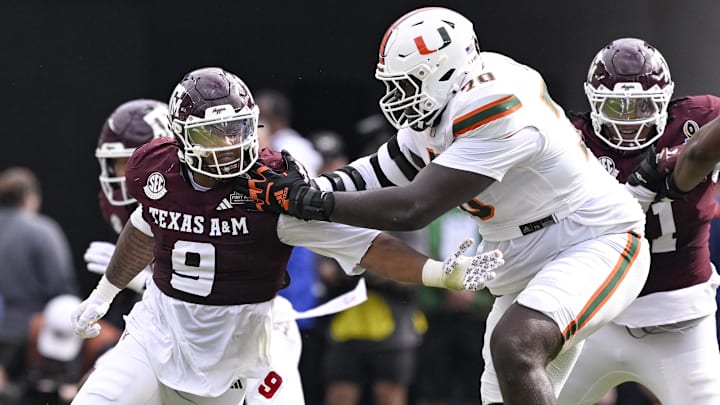 Texas A&M Aggies defensive end Cashius Howell (9) rushes the line past Miami Hurricanes offensive lineman Markel Bell (70) 
