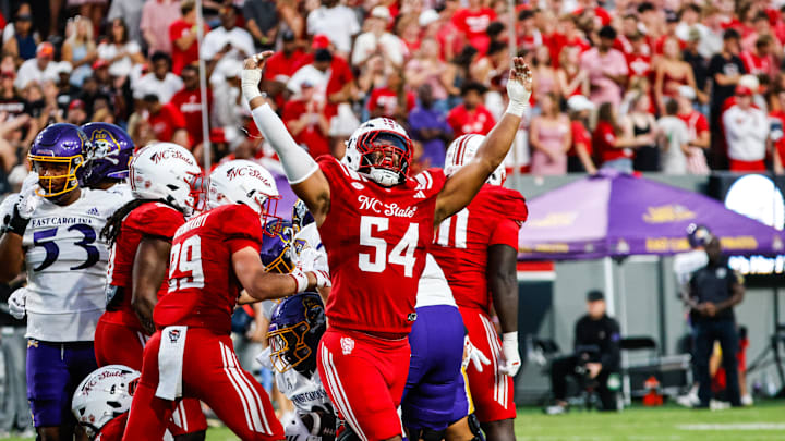 Aug 28, 2025; Raleigh, North Carolina, USA; North Carolina State Wolfpack defensive end Sabastian Harsh (54) celebrates a sack during the first half of the game against East Carolina Pirates at Carter-Finley Stadium. Mandatory Credit: Jaylynn Nash-Imagn Images Aug 28, 2025; Raleigh, North Carolina, USA; North Carolina State Wolfpack defensive end Sabastian Harsh (54) celebrates a sack during the first half of the game against East Carolina Pirates at Carter-Finley Stadium. Mandatory Credit: Jaylynn Nash-Imagn Images