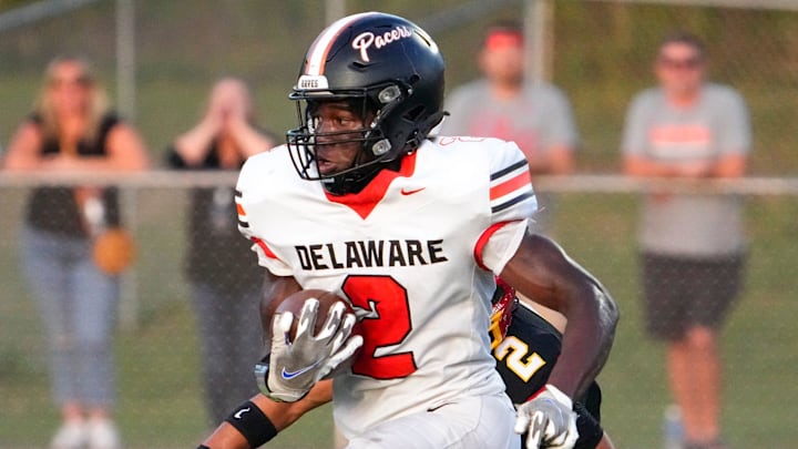 Sep 13, 2024; Sunbury, Ohio, USA; Delaware Hayes Favour Akih (2) runs the ball in for a touchdown against Big Walnut in the first half at Big Walnut High School.