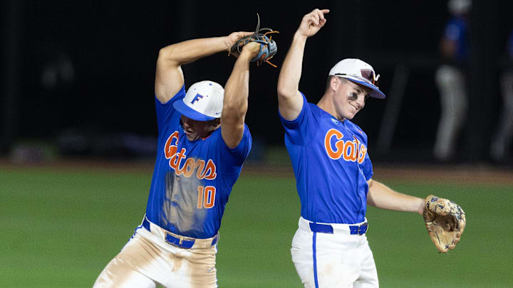 Jun 2, 2024; Stillwater, OK, USA; Florida infielder Colby Shelton (10) and infielder Cade Kurland (4) celebrate after a NCAA regional baseball game against Oklahoma State at O'Brate Stadium. Mandatory Credit: Mitch Alcala-The Oklahoman Jun 2, 2024; Stillwater, OK, USA; Florida infielder Colby Shelton (10) and infielder Cade Kurland (4) celebrate after a NCAA regional baseball game against Oklahoma State at O'Brate Stadium. Mandatory Credit: Mitch Alcala-The Oklahoman
