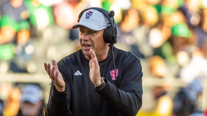 Oct 11, 2025; South Bend, Indiana, USA; NC State Wolfpack head coach Dave Doeren claps as he walks onto the field against the Notre Dame Fighting Irish during the second half at Notre Dame Stadium. Mandatory Credit: Michael Caterina-Imagn Images