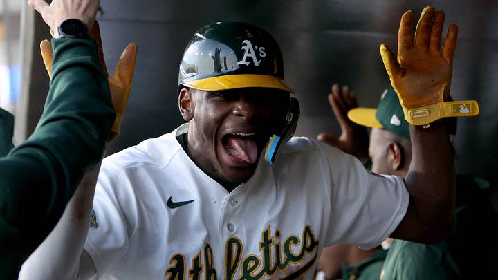 Apr 14, 2026; West Sacramento, California, USA; Athletics center fielder Denzel Clark (1) reacts in the dugout after scoring a run against the Texas Rangers during the third inning at Sutter Health Park. Mandatory Credit: Dennis Lee-Imagn Images