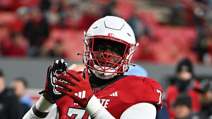 Nov 25, 2023; Raleigh, North Carolina, USA; North Carolina State Wolfpack offensive lineman Anthony Carter Jr. (75) warms up prior to a game against the North Carolina Tar Heels at Carter-Finley Stadium. Mandatory Credit: Rob Kinnan-Imagn Images Nov 25, 2023; Raleigh, North Carolina, USA; North Carolina State Wolfpack offensive lineman Anthony Carter Jr. (75) warms up prior to a game against the North Carolina Tar Heels at Carter-Finley Stadium. Mandatory Credit: Rob Kinnan-Imagn Images