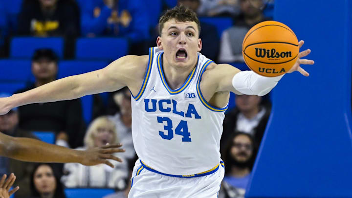 Nov 4, 2024; Los Angeles, California, USA; UCLA Bruins forward Tyler Bilodeau (34) chases after a loose ball during the first half against the Rider Broncs at Pauley Pavilion presented by Wescom. At left is UCLA Bruins guard Dylan Andrews (2). Mandatory Credit: Robert Hanashiro-Imagn Images