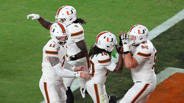 Jan 19, 2026; Miami Gardens, FL, USA; Miami Hurricanes wide receiver Malachi Toney (10) celebrates with offensive lineman James Brockermeyer (52) after scoring a touchdown against the Indiana Hoosiers during the second half of the College Football Playoff National Championship game at Hard Rock Stadium. Mandatory Credit: James Lang-Imagn Images