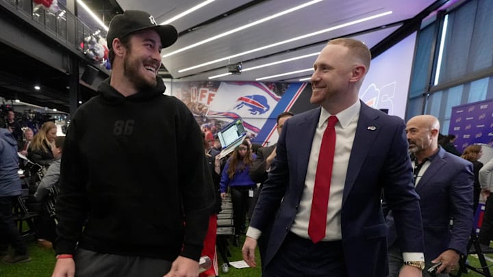 After hugging new Bills head coach Joe Brady, tight end Dalton Kincaid laughs and jokes with him after the press conference introducing Brady as the new head coach at the Bills field house in Orchard Park ended on Jan. 29, 2026. After hugging new Bills head coach Joe Brady, tight end Dalton Kincaid laughs and jokes with him after the press conference introducing Brady as the new head coach at the Bills field house in Orchard Park ended on Jan. 29, 2026.