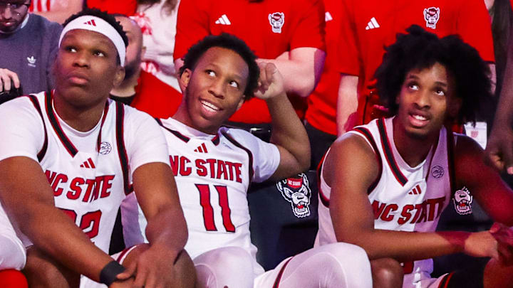 Feb 7, 2026; Raleigh, North Carolina, USA; NC State Wolfpack guard Quadir Copeland (11), forward Ven-Allen Lubin (22) and guard Jr. Paul McNeil (2) during the first half of the game against the Virginia Tech Hokies at Lenovo Center. Mandatory Credit: Jaylynn Nash-Imagn Images