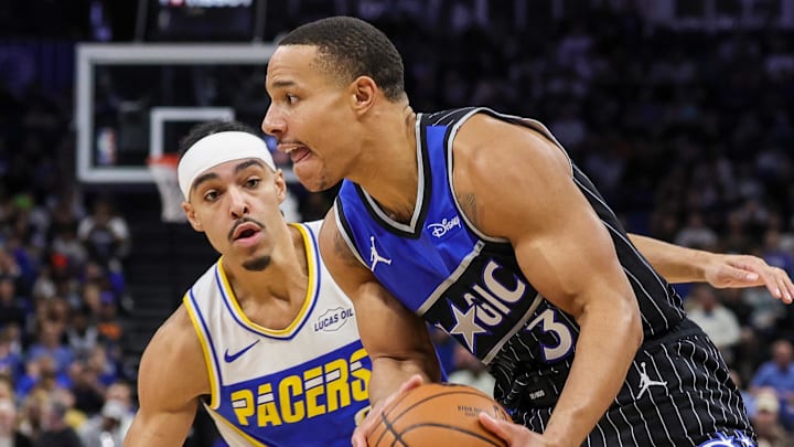Jan 4, 2026; Orlando, Florida, USA; Orlando Magic guard Desmond Bane (3) drives to the basket against Indiana Pacers guard Andrew Nembhard (2) during the first quarter at Kia Center. Mandatory Credit: Mike Watters-Imagn Images