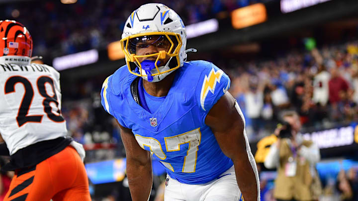 Nov 17, 2024; Inglewood, California, USA; Los Angeles Chargers running back J.K. Dobbins (27) celebrates his touchdown scored against the Cincinnati Bengals during the second half at SoFi Stadium. Mandatory Credit: Gary A. Vasquez-Imagn Images