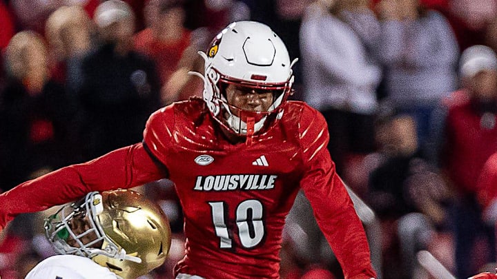 Louisville's Ben Perry (10) jumped to break up a pass during first half action as the Louisville Cardinals battled the Notre Dame Fighting Irish on Saturday, Oct. 7, 2023.