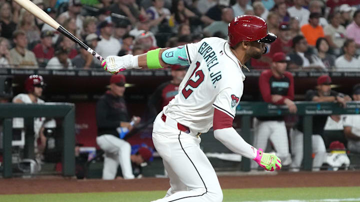 Aug 4, 2025; Phoenix, Arizona, USA; Arizona Diamondbacks outfielder Lourdes Gurriel Jr. (12) hits an RBI single against the San Diego Padres in the first inning at Chase Field. Mandatory Credit: Rick Scuteri-Imagn Images Aug 4, 2025; Phoenix, Arizona, USA; Arizona Diamondbacks outfielder Lourdes Gurriel Jr. (12) hits an RBI single against the San Diego Padres in the first inning at Chase Field. Mandatory Credit: Rick Scuteri-Imagn Images