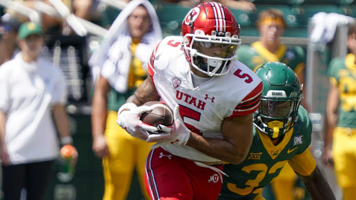 Sep 9, 2023; Waco, Texas, USA; Utah Utes wide receiver Mycah Pittman (5) makes the catch in front of Baylor Bears safety DJ Coleman (33) during the second half at McLane Stadium. Mandatory Credit: Raymond Carlin III-Imagn Images