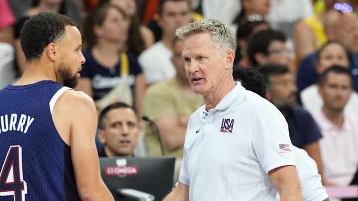 Jul 28, 2024; Villeneuve-d'Ascq, France; United States head coach Steve Kerr talks to shooting guard Stephen Curry (4) in the second quarter against Serbia during the Paris 2024 Olympic Summer Games at Stade Pierre-Mauroy. 