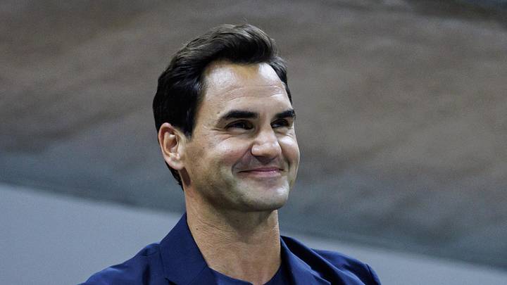 Roger Federer watches Aryna Sabalenka and smiles Roger Federer watches Aryna Sabalenka and smiles