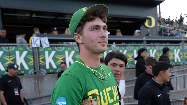 Oregon pitcher Tanner Bradley waits along the first baseline in front of a row of “Ks” for strikeouts amassed by the pitching squad during the game against Washington State on day two of the NCAA Eugene Regional Tournament at PK Park n Eugene May 30, 2026. Oregon pitcher Tanner Bradley waits along the first baseline in front of a row of “Ks” for strikeouts amassed by the pitching squad during the game against Washington State on day two of the NCAA Eugene Regional Tournament at PK Park n Eugene May 30, 2026.