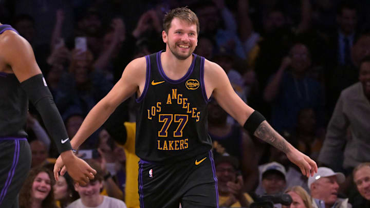 Mar 31, 2026; Los Angeles, California, USA;  Los Angeles Lakers guard Luka Doncic (77) smiles after a dunk in the final minutes of the game against the Cleveland Cavaliers at Crypto.com Arena. Mandatory Credit: Jayne Kamin-Oncea-Imagn Images