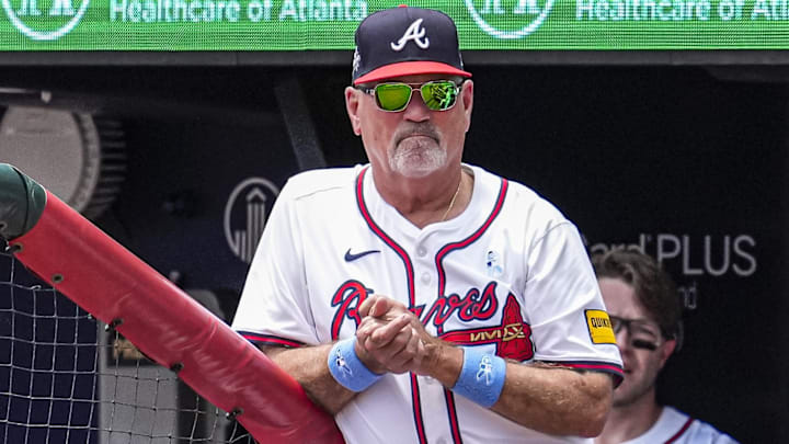 Atlanta Braves manager Brian Snitker (43) is shown in the dugout against the Colorado Rockies during the second inning at Truist Park.