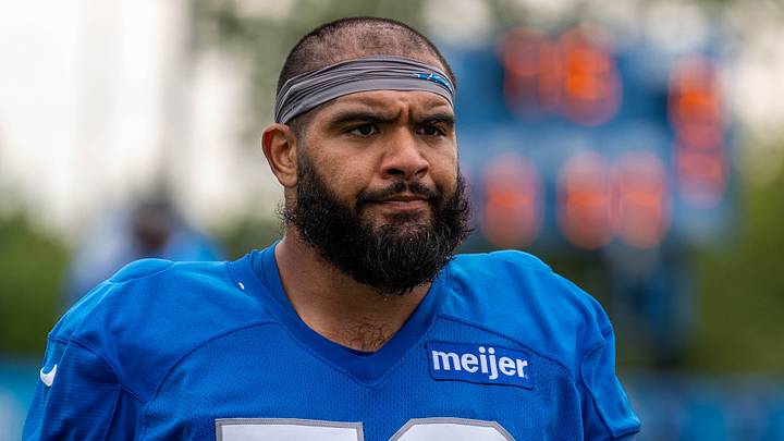 Detroit Lions offensive lineman Juice Scruggs (70) walks off the field following training camp practice