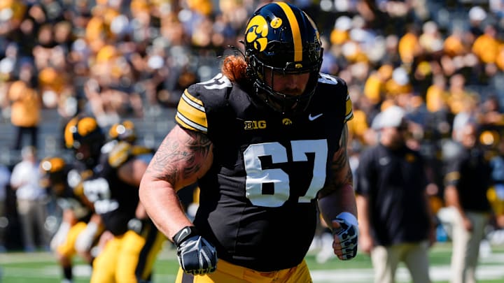 Iowa Hawkeyes offensive lineman Gennings Dunker (67) warms up before a football game against the Indiana Hoosiers Sept. 27, 2025 at Kinnick Stadium in Iowa City, Iowa.