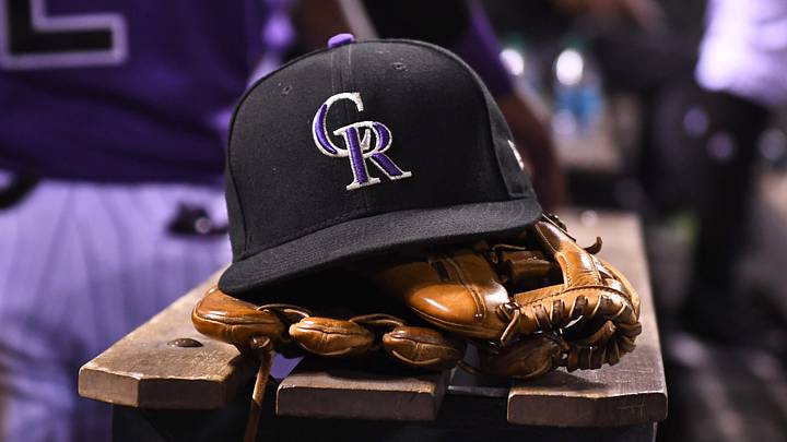 General view of the hat and glove of the Colorado Rockies at Coors Field. Credit: Ron Chenoy-USA TODAY Sports General view of the hat and glove of the Colorado Rockies at Coors Field. Credit: Ron Chenoy-USA TODAY Sports