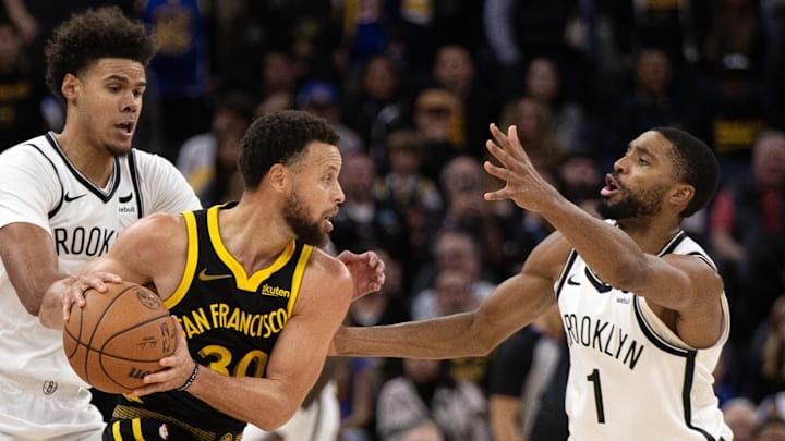 Cameron Johnson guards Stephen Curry during the Nets' 124–120 loss to the Warriors on Dec. 16, 2023. Cameron Johnson guards Stephen Curry during the Nets' 124–120 loss to the Warriors on Dec. 16, 2023.