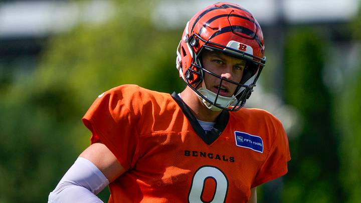 Cincinnati Bengals quarterback Joe Burrow (9) runs a play during practice at the Paycor Stadium practice facility in downtown Cincinnati on Monday, Aug. 3, 2026. Cincinnati Bengals quarterback Joe Burrow (9) runs a play during practice at the Paycor Stadium practice facility in downtown Cincinnati on Monday, Aug. 3, 2026.