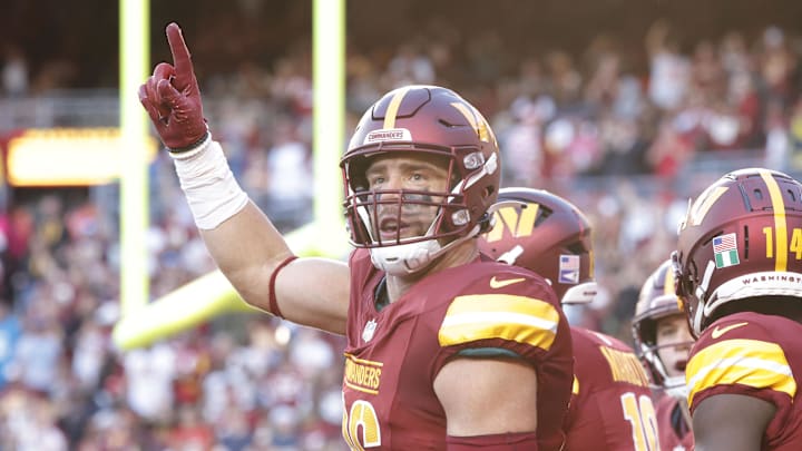 Oct 20, 2024; Landover, Maryland, USA; Washington Commanders tight end Zach Ertz (86) celebrates with fans in the stands after scoring a touchdown during the second quarter against the Carolina Panthers at Northwest Stadium. Mandatory Credit: Amber Searls-Imagn Images