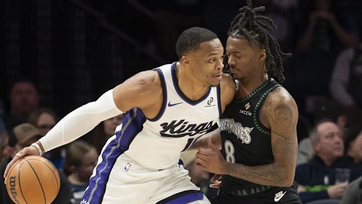 Dec 14, 2025; Minneapolis, Minnesota, USA; Sacramento Kings guard Russell Westbrook (18) dribbles towards the basket as Minnesota Timberwolves guard Bones Hyland (8) plays defense in the first half at Target Center. Dec 14, 2025; Minneapolis, Minnesota, USA; Sacramento Kings guard Russell Westbrook (18) dribbles towards the basket as Minnesota Timberwolves guard Bones Hyland (8) plays defense in the first half at Target Center.