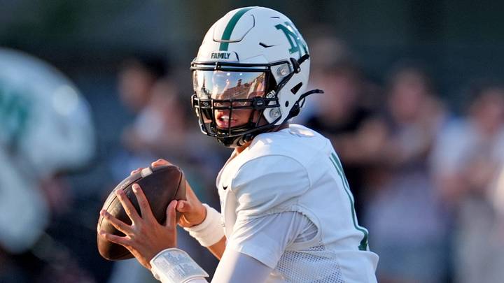 Norman North's Nash Henry looks to throw a pass during a high school football game between Norman and Norman North at Norman High School, in Norman, Okla., Aug. 28, 2026. Norman North's Nash Henry looks to throw a pass during a high school football game between Norman and Norman North at Norman High School, in Norman, Okla., Aug. 28, 2026.